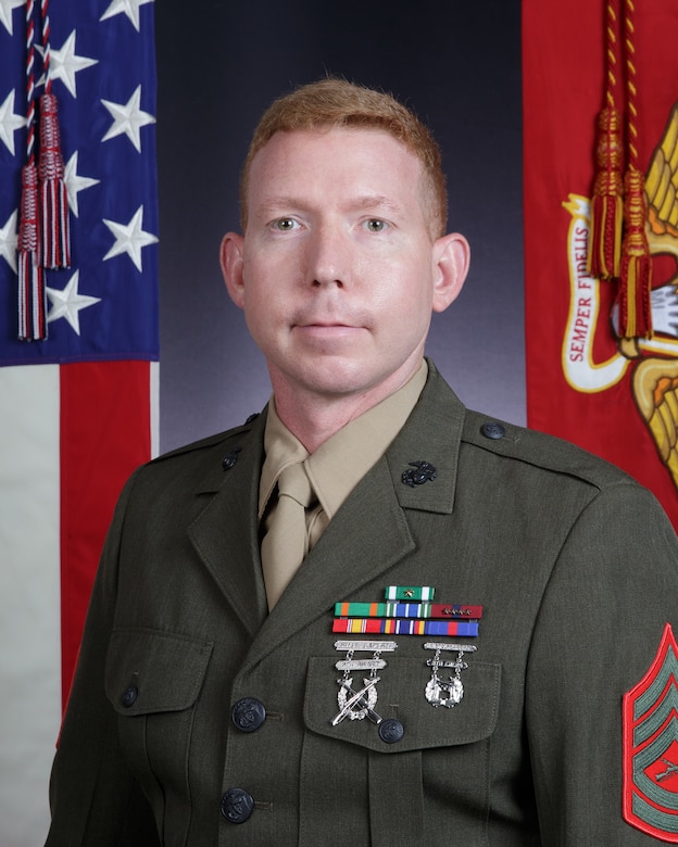 Bio picture with US and USMC display flags