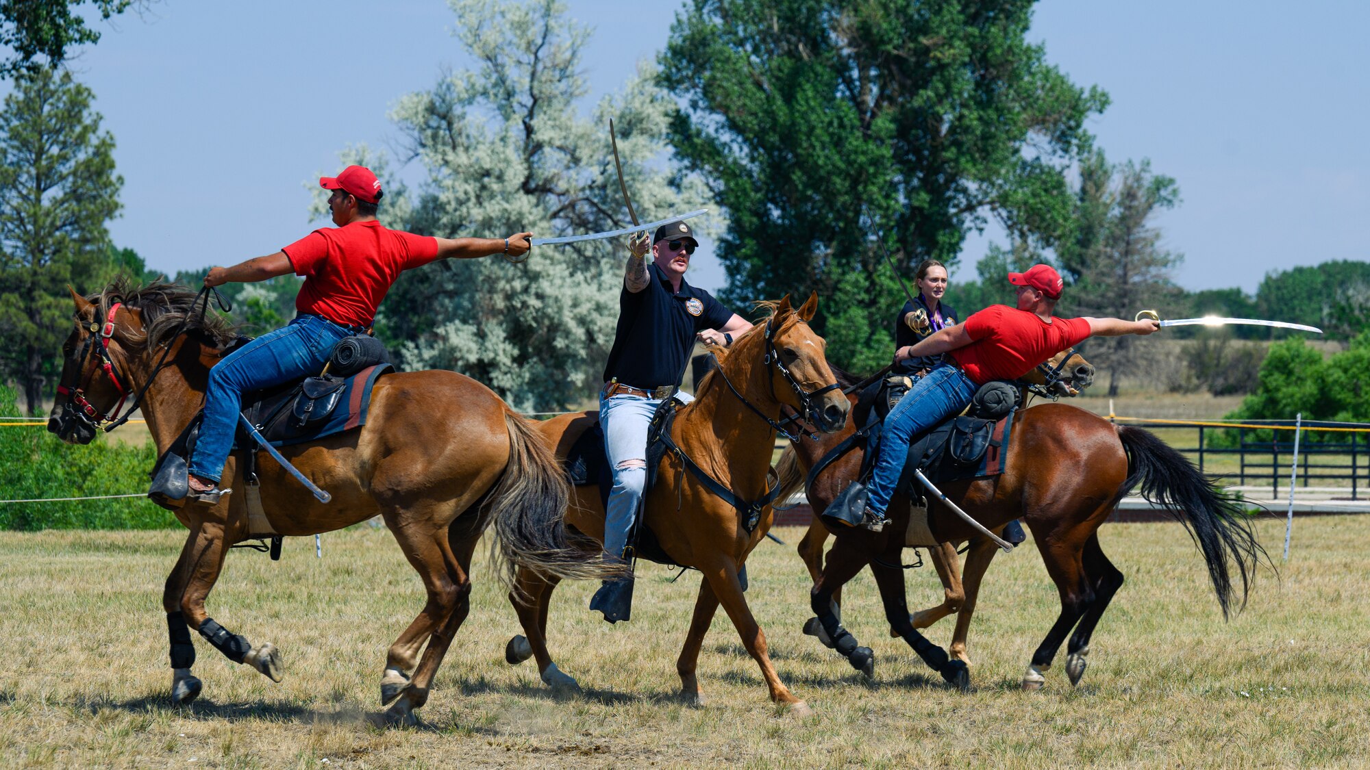 Mounted Color Guard members ride horses in a performance.