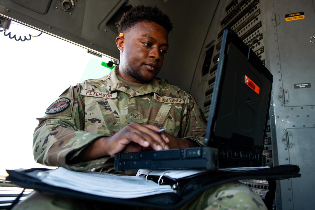 Airman verifying information on laptop