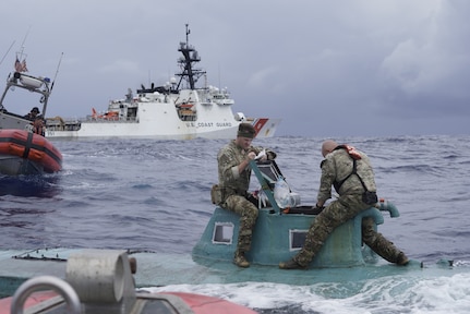 Members of the Coast Guard Cutter Waesche (WMSL-751) law enforcement boarding team inspect a self-propelled semi-submersible (SPSS) in international waters of the Eastern Pacific Ocean, Nov. 20, 2023.