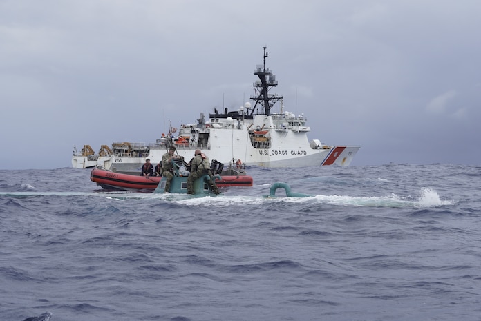 Members of the Coast Guard Cutter Waesche (WMSL-751) law enforcement boarding team inspect a self-propelled semi-submersible (SPSS) in international waters of the Eastern Pacific Ocean, Nov. 20, 2023.