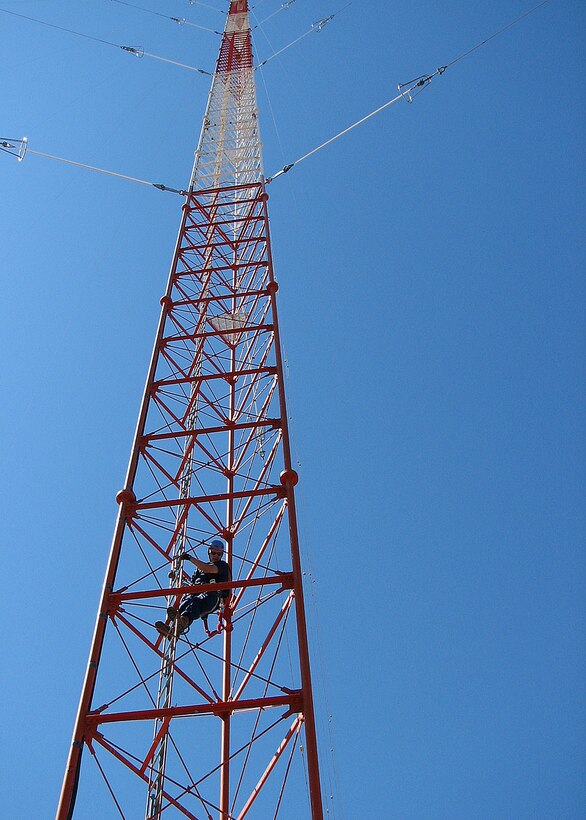 A loran tower supervisor from Civil Engineering Unit Oakland begins climbing the 600-foot Coast Guard loran tower to conduct routine maintenance Sept. 18, 2008. The loran station crew ceased broadcasting of their domestic signal at noon, Feb. 8, 2010, as part of a nationwide termination of the North American Long Range Navigation-C signal.