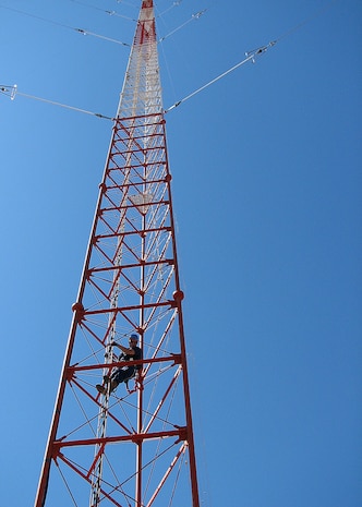 A loran tower supervisor from Civil Engineering Unit Oakland begins climbing the 600-foot Coast Guard loran tower to conduct routine maintenance Sept. 18, 2008. The loran station crew ceased broadcasting of their domestic signal at noon, Feb. 8, 2010, as part of a nationwide termination of the North American Long Range Navigation-C signal.