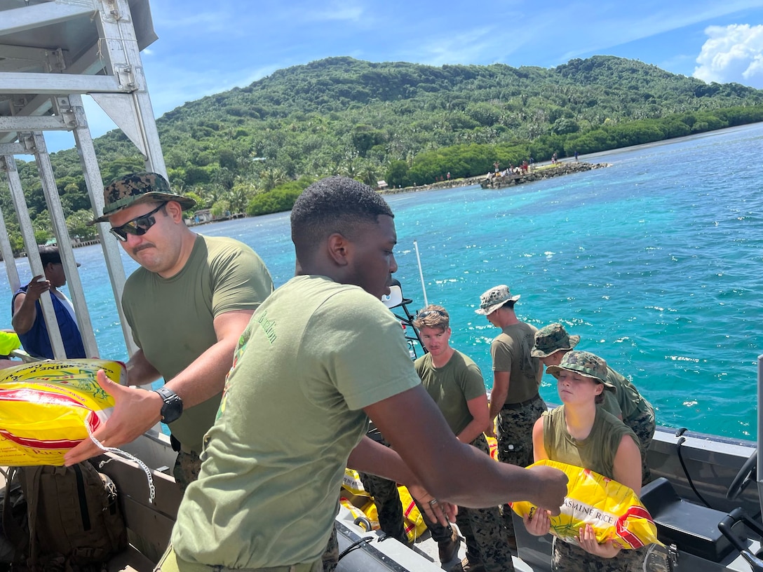 U.S. Marines and Sailors with Combat Logistics Battalion 13, Combat Logistics Regiment 17, 1st Marine Logistics Group, provide humanitarian disaster relief preparation by offloading approximately one thousand bags of rice and three thousand cases of water to Federal States of Micronesia outer island of Chuuk during exercise Koa Moana 24 in the Chuuk Lagoon, July 5-9, 2024. During Koa Moana’s deployment throughout the Indo-Pacific region, U.S. Marines and Sailors from I Marine Expeditionary Force work to strengthen alliances and partnerships with development of interoperable capabilities, combined operations, theater security cooperation, and capacity-building efforts. Exercises like Koa Moana administer 1st MLG to tackle complex challenges by fostering collaboration among bold thinkers and employing creative methods to optimize prepositioning, enhance sustainment and distribution networks, and bolster readiness in distributed environments such as Palau, the Federal States of Micronesia, and Papua New Guinea. (U.S. Marine Corps photo by Gunnery Sgt. Sean Arnold)