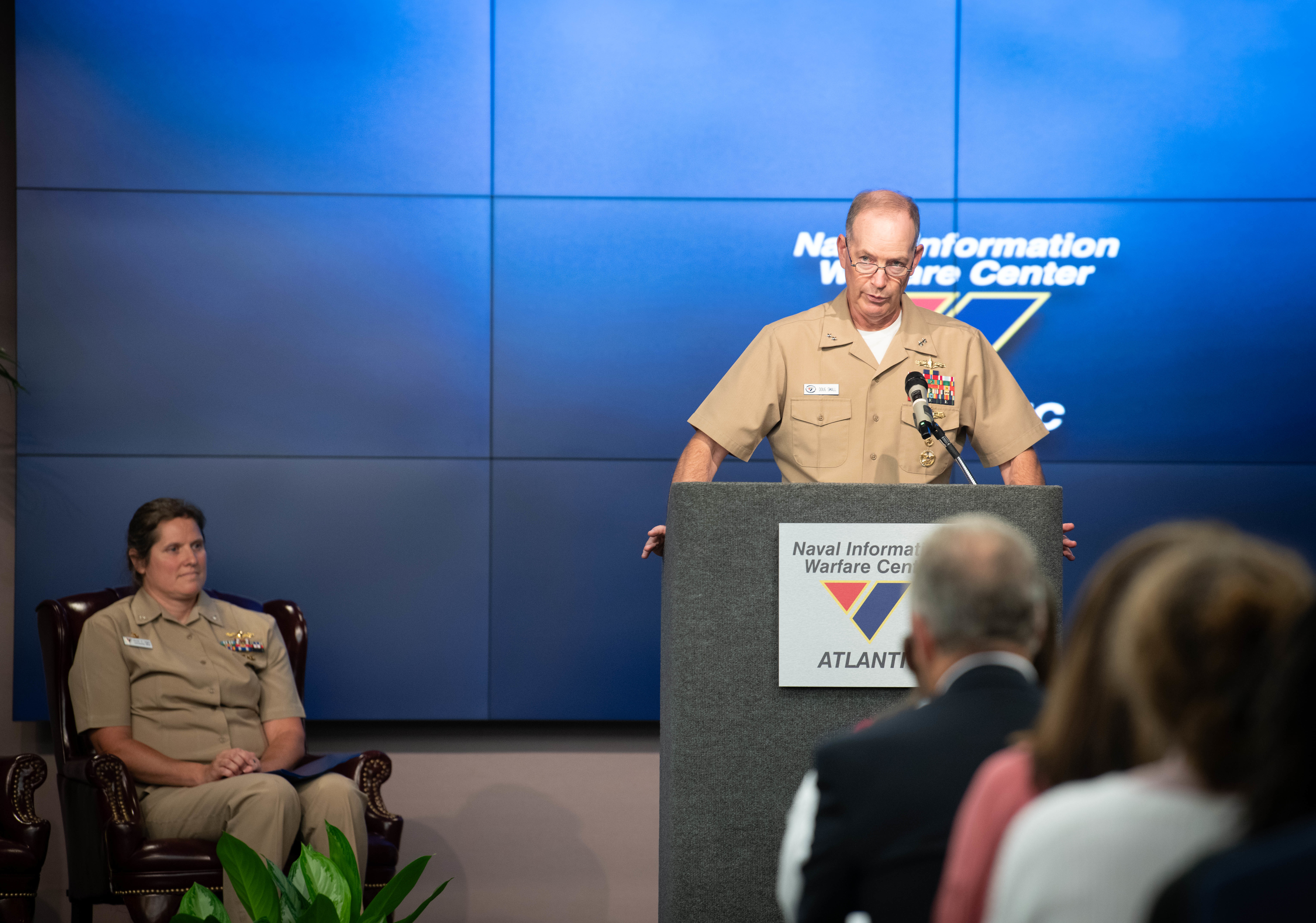 U.S. Navy Rear Adm. Douglas Small, Naval Information Warfare Systems Command (NAVWAR) commander, delivers a speech during a change of command ceremony at Joint Base Charleston, South Carolina, July 18, 2024. Small praised Capt. Nicole Nigro, Naval Information Warfare Center (NIWC) Atlantic outgoing commanding officer, for her achievements during the ceremony.