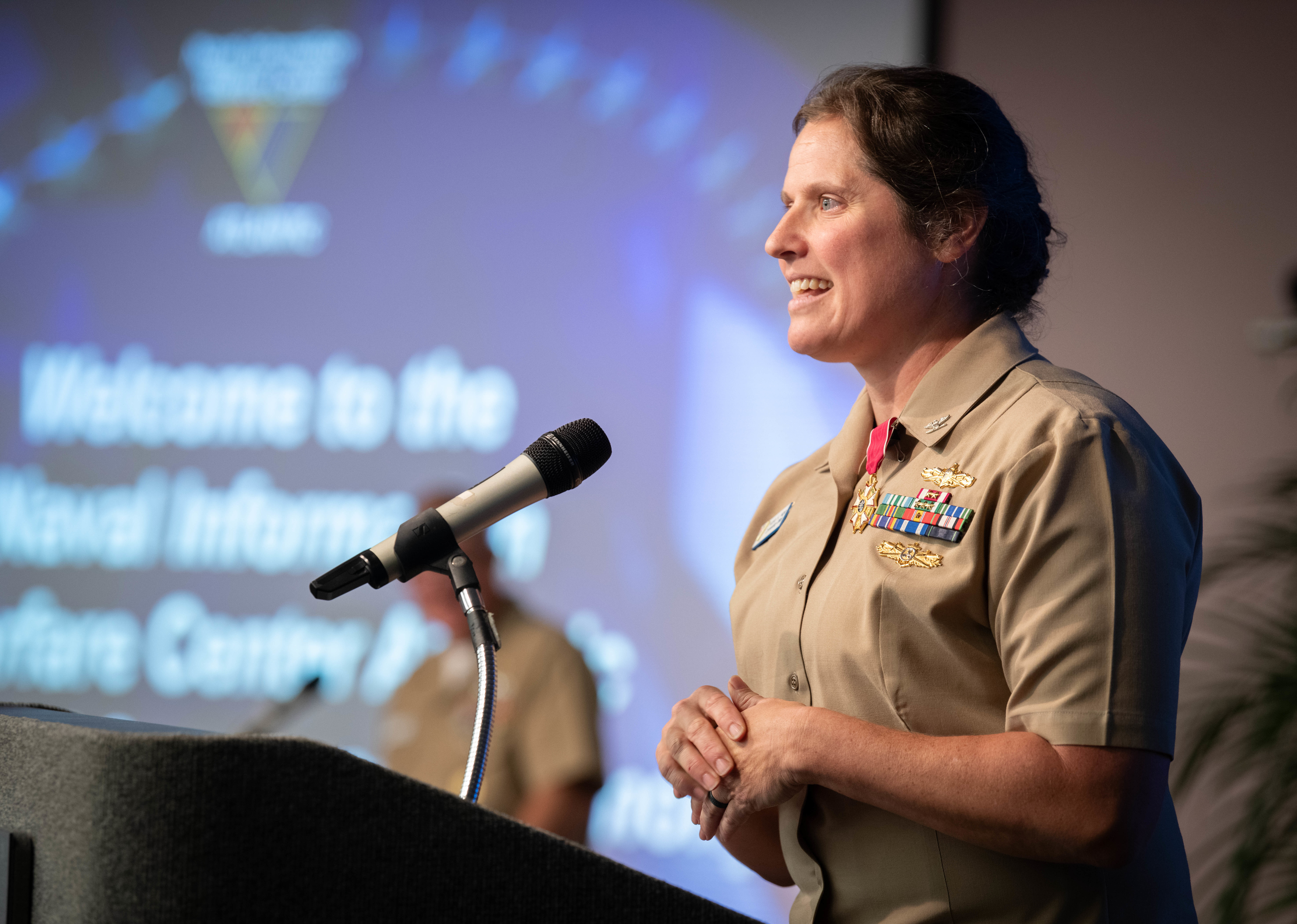 U.S. Navy Capt. Nicole Nigro, Naval Information Warfare Center (NIWC) Atlantic outgoing commanding officer, gives remarks during a change of command ceremony at Joint Base Charleston, South Carolina, July 18, 2024. Nigro was relieved of command by Capt. Matthew O’Neal during the ceremony.