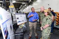 Adm. Lisa Franchetti, Chief of Naval Operations, receives a briefing on the Poniard Foreign Comparative Test (FCT) by a Textron official at the Rim of the Pacific Exercise (RIMPAC), 12 July.