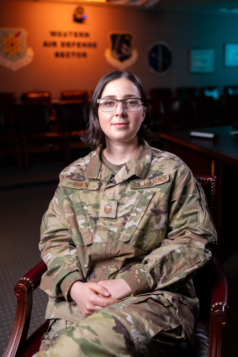 U.S. Air Force Master Sgt. Haley Rankin, 225th Air Defense Squadron weapons controller, poses for a picture in the Western Air Defense Sector’s conference room on Joint Base Lewis-McChord, Washington, May 30, 2024.  She was recognized for her excellence in leadership, job performance, and whole Airman concept by being award the Air National Guard’s 2024 Outstanding Non-Commissioned Officer of the Year.  (U.S.  Air National Guard photo by Tech. Sgt. Darby Arnold)
