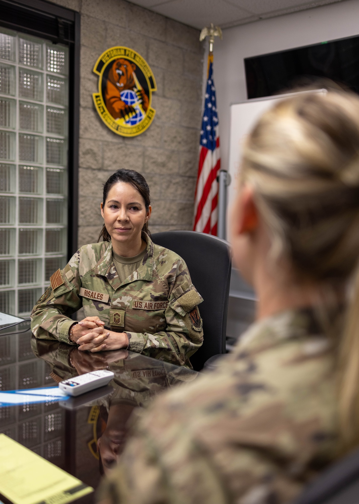 U.S. Air Force Senior Master Sgt. Alejandra Rosales, assigned to the 147th Combat Communications Squadron, 195th Wing, California Air National Guard, meets with a guardsman May 15, 2024, San Diego California. Rosales has been selected as the Air National Guard Senior Non-Commissioned Officer of the Year for 2024. (U.S. Air National Guard photo by Tech Sgt. Darby Arnold)