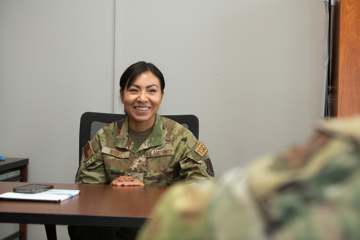 U.S. Air Force Master Sergeant Diana Nogiec, 110th Wing First Sergeant, speaks with a subordinate at Battle Creek Air National Guard Base, Michigan, on July 2, 2024. Nogiec, recognized for her outstanding leadership and dedication to mission success, was awarded Outstanding Airman of the Year in the First Sergeant category. (U.S. Air National Guard photo by Staff Sgt. Bethany Rizor)