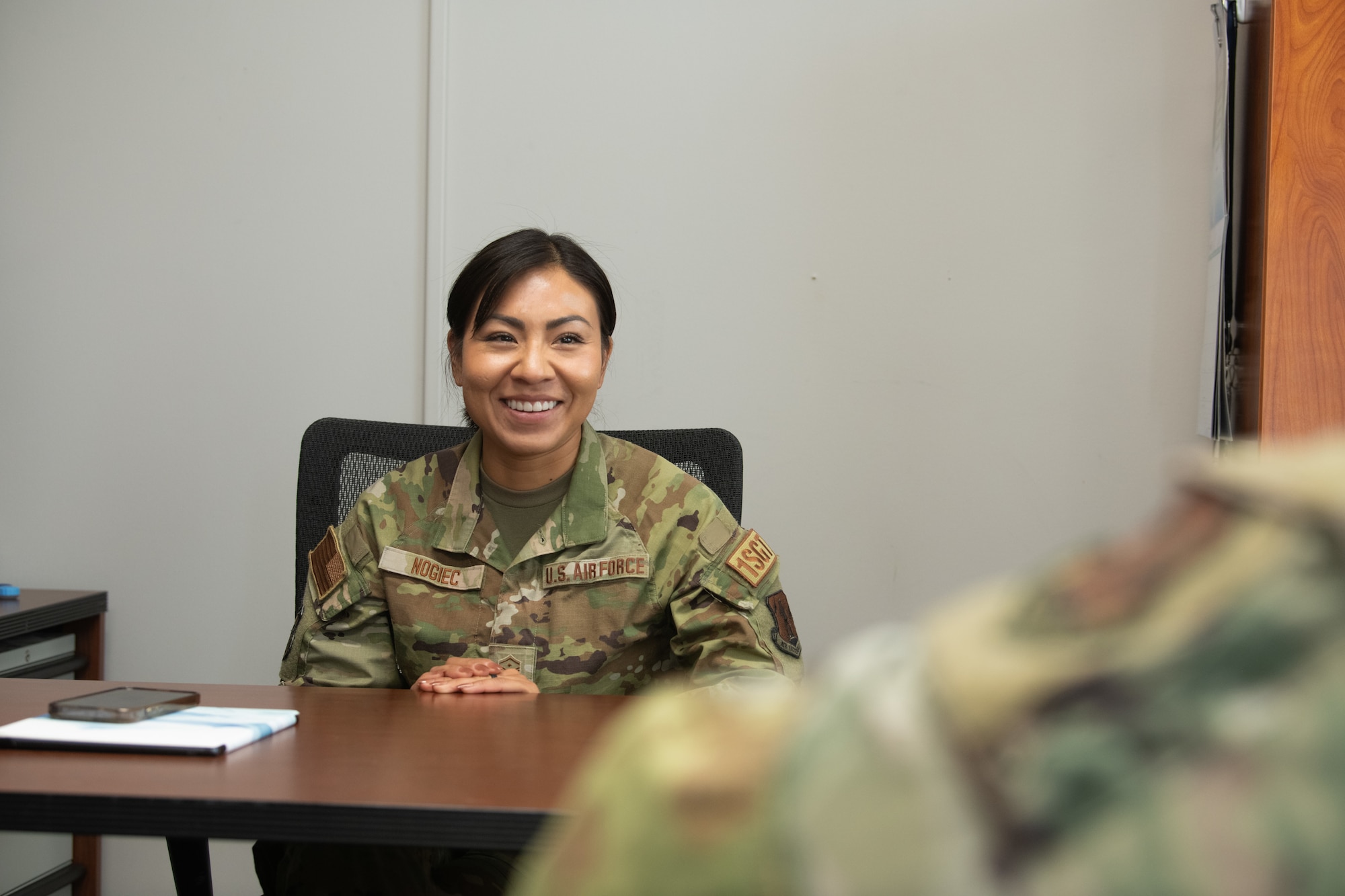 U.S. Air Force Master Sergeant Diana Nogiec, 110th Wing First Sergeant, speaks with a subordinate at Battle Creek Air National Guard Base, Michigan, on July 2, 2024. Nogiec, recognized for her outstanding leadership and dedication to mission success, was awarded Outstanding Airman of the Year in the First Sergeant category. (U.S. Air National Guard photo by Staff Sgt. Bethany Rizor)
