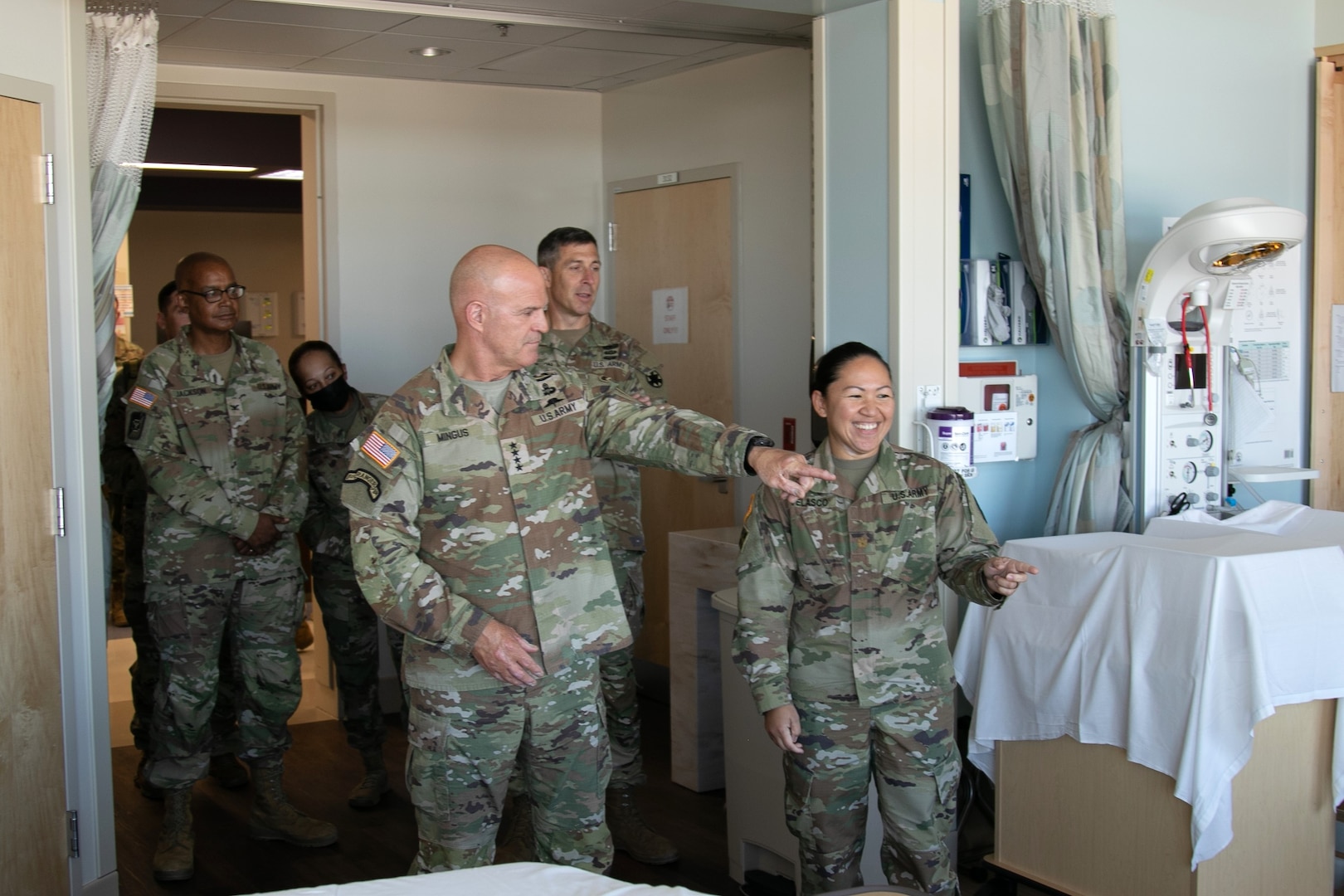 GEN James Mingus jokes with MAJ Regina Velasco during Mother-Baby department tour