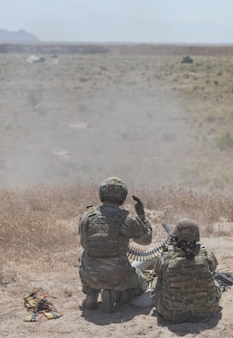 Staff Sgt. Jason Postl, Senior Gunner, assigned to 84th Training Command, coached Soldiers on how to properly aim with a Browning M2 .50-caliber Machine Gun at the live-fire exercise during the Red Dragon 24 training at Dugway Proving Ground, Utah, on June 14, 2024. Soldiers practiced immediate action drills to address malfunctions, such as clearing jams and misfires, while maintaining readiness.