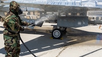 A soldier assigned to the 76th Operational Response Command performed the final decontamination rinse cycle on an airplane as part of the Chemical, Biological, Radiological, and Nuclear (CBRN) training to remove or neutralize hazardous substances during the Red Dragon 24 training at Dugway Proving Ground, Utah, on June 21, 2024. CBRN Soldiers ensured the aircraft's decontamination, safeguarded personnel, and prevented the spread of hazardous substances.