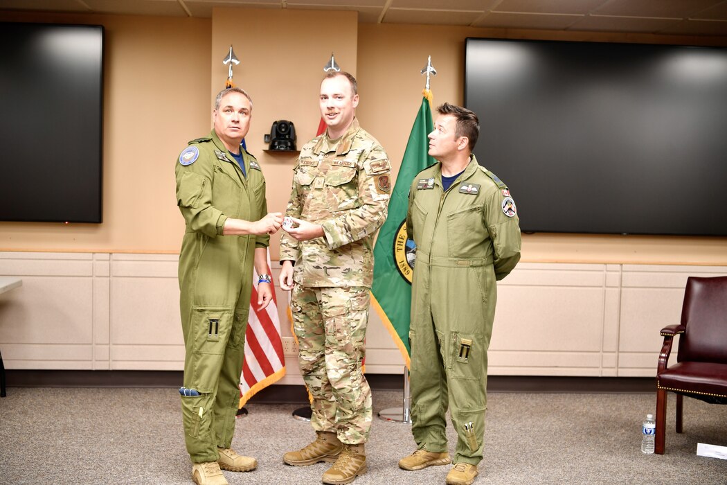 General presenting awards to an Airman