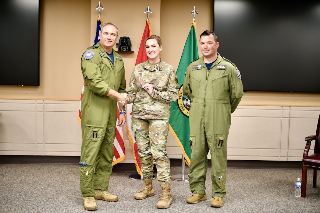 General presenting awards to an Airman