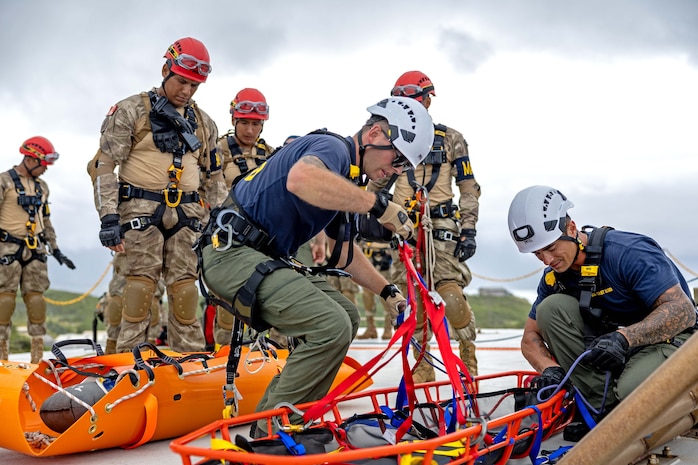 Peruvian marines assigned to Combat Engineering Battalion conduct a search and rescue training exercise with the U.S. Coast Guard at Marine Corps Base Hawaii during Exercise Rim of the Pacific (RIMPAC), July 12.
