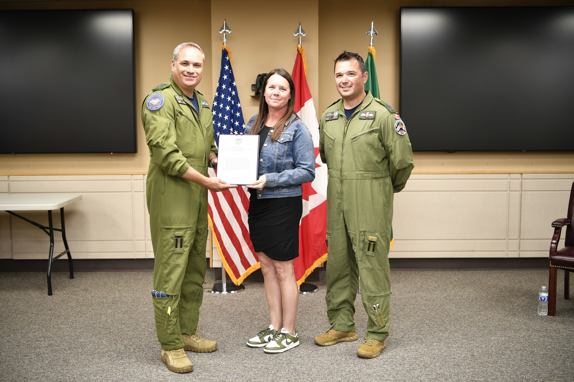 General presenting awards to an Airman