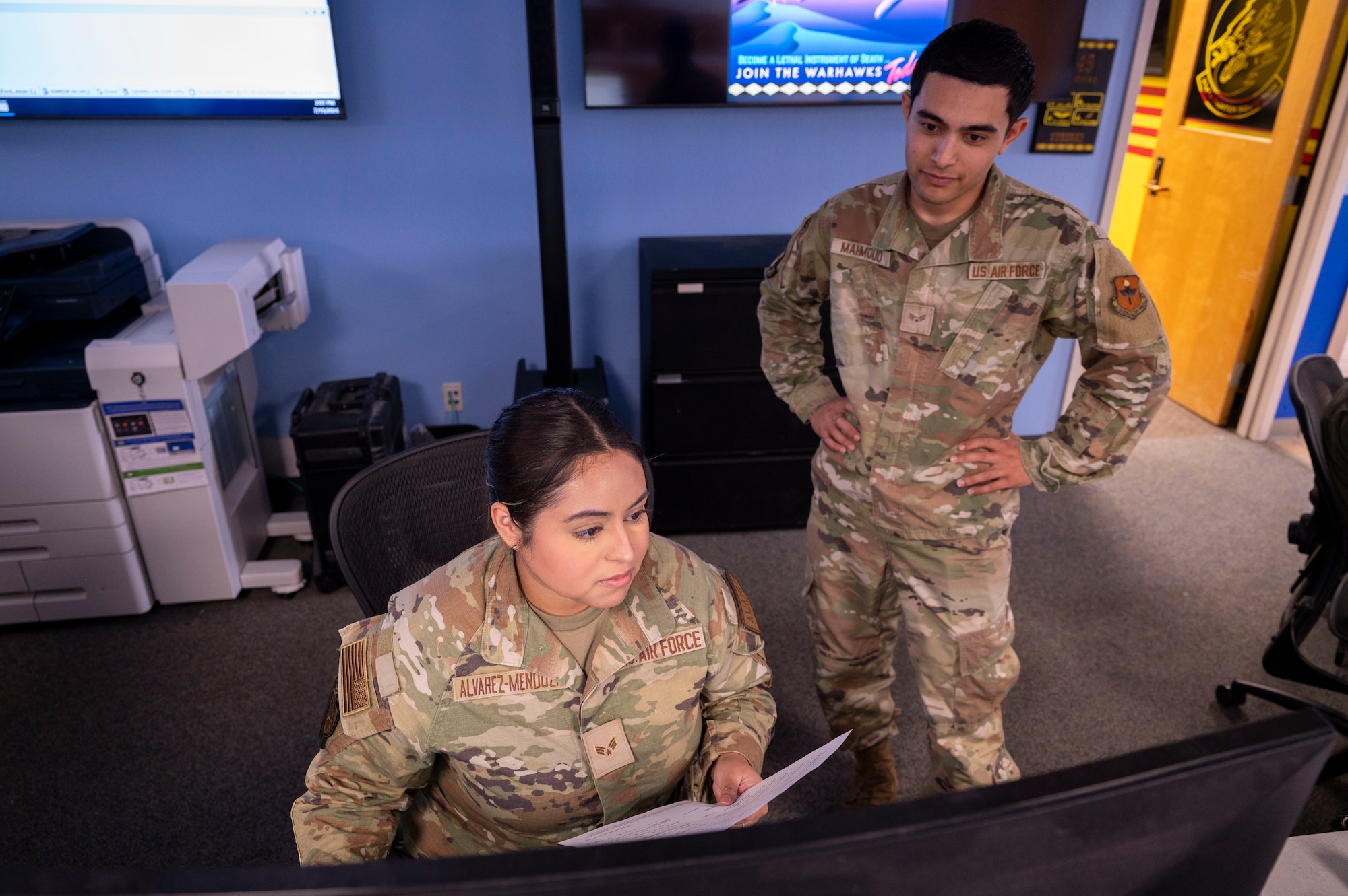 U.S. Air Force Senior Airman Noelia Alvarez-Mendoza, 314th Fighter Squadron aviation resource management journeyman, left, and U.S. Air Force Senior Airman Yosef Mahmoud, 54th Operation Support Squadron host aviation resource management journeyman, input data into a computer at Holloman Air Force Base, New Mexico, July 15, 2024.