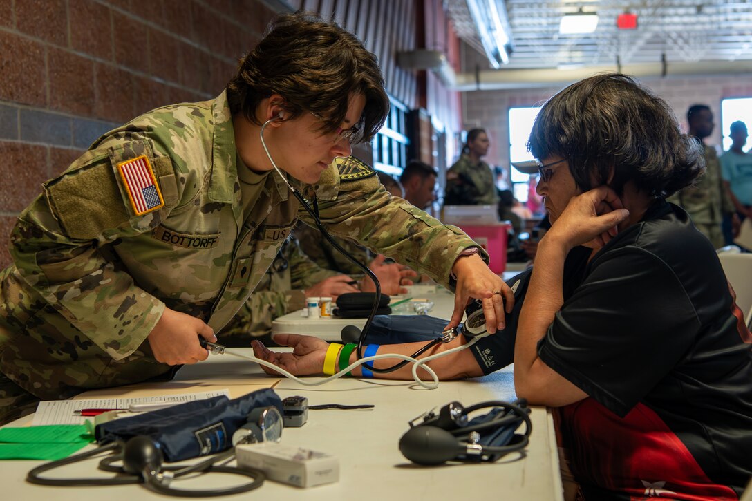 U.S. Army Spc. Brianna Bottorff, a combat medic assigned to the 215th Medical Company, Indiana Army National Guard, triages a patient at the Blackfeet tribal Health - Operation Walking Shield Innovative Readiness Training medical mission at Browning High School in Browning, Mont., July 17, 2024.