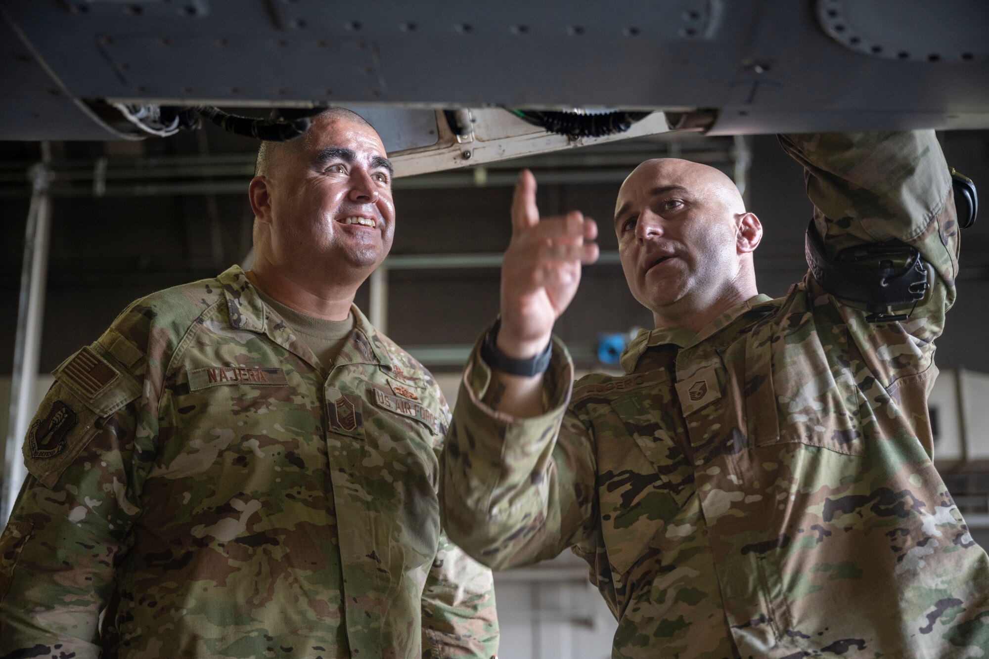 U.S. Air Force Chief Master Sgt. David Najera, left, 35th Fighter Wing command chief, and Master Sgt. Joshua Lucero, 13th Fighter Generation Squadron specialist section chief, inspect an F-16 Fighting Falcon during a Wild Weasel Walkthrough at Misawa Air Base, Japan, July 11, 2024.