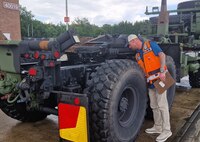 Anthony Miller, the quality assurance supervisor at the Dülmen Army Prepositioned Stocks-2 worksite with Army Field Support Battalion-Germany, conducts quality assurance surveillance on APS-2 equipment at Dülmen. Miller is also the site’s primary contracting officer representative and the program manager for the customs and agricultural programs. (U.S. Army courtesy photo)