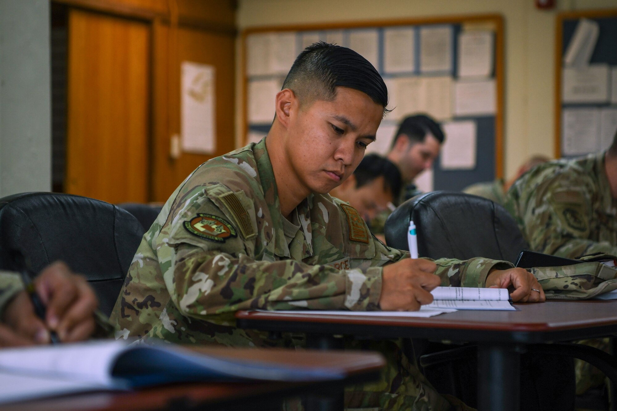 An Airman conducts a Backflow Prevention Course progress check test.
