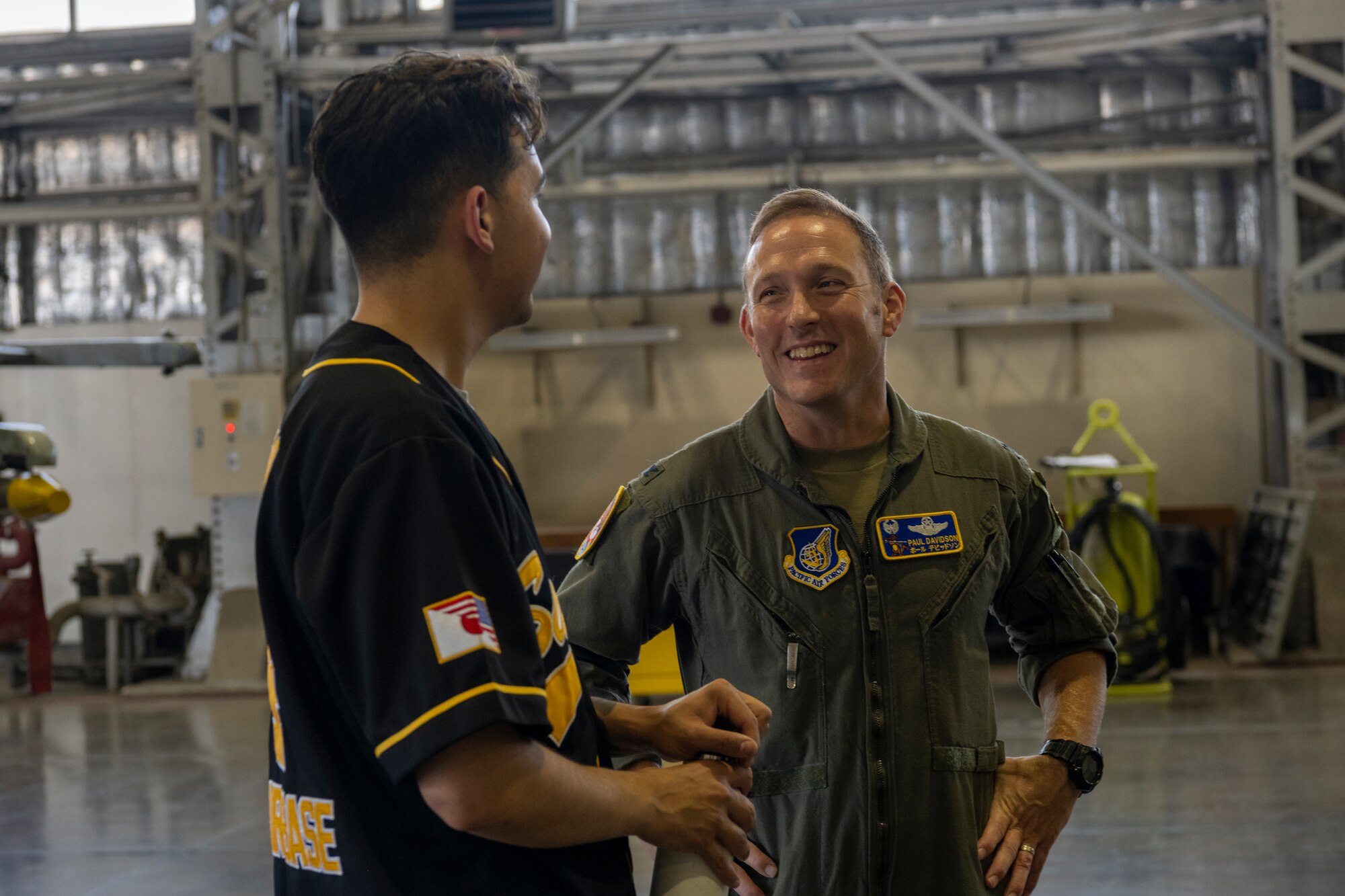 U.S. Air Force Col. Paul Davidson, 35th Fighter Wing commander, speaks to a load crew member during the 35th Maintenance Group’s 2nd quarter weapons load competition at Misawa Air Base, Japan, July 18, 2024.
