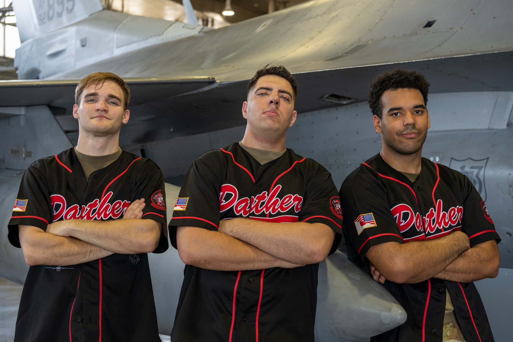 U.S. Air Force Senior Airman Cole Lewis, left, Staff Sgt. Brandon Harman, middle, and Senior Airman Rodirick Witherspoon, right, 13th Fighter Generation Squadron load crew members, pose for a group photo after winning first place and the Load Crew of the Quarter title during the 35th Maintenance Group’s 2nd quarter weapons load competition at Misawa Air Base, Japan, July 18, 2024.