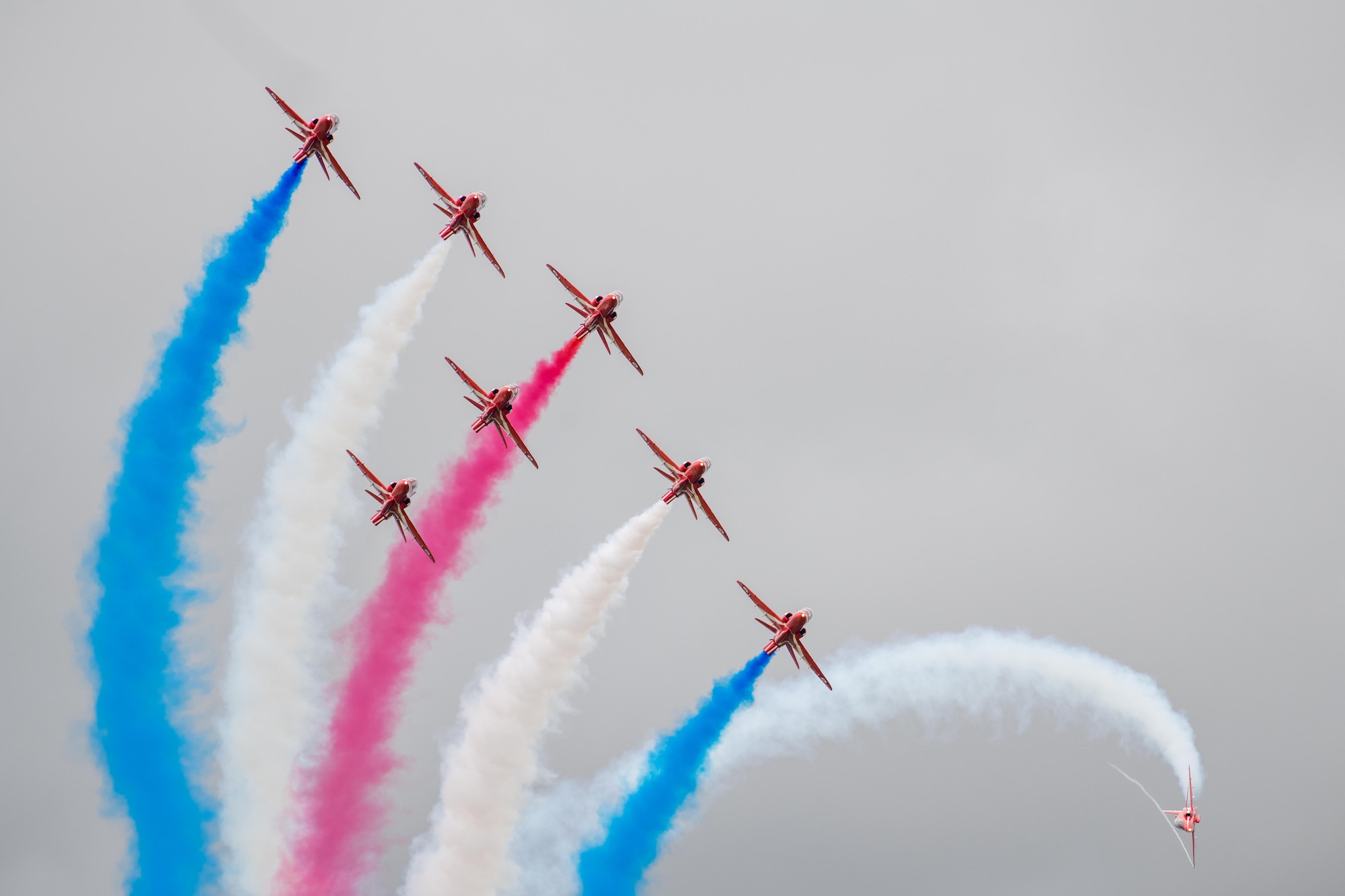 The Royal Air Force Red Arrow aeronautical team conduct an aerial demonstration