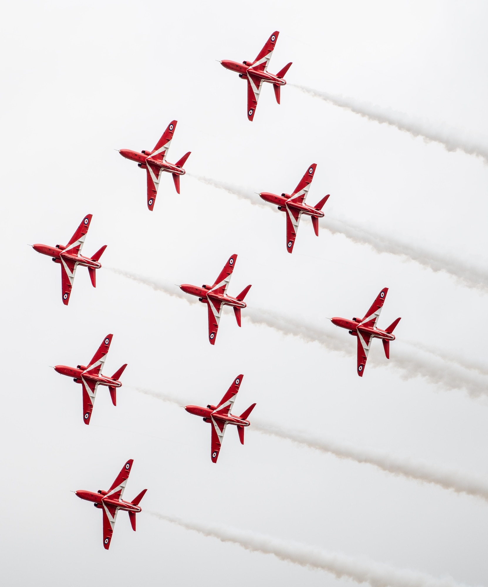 The Royal Air Force Red Arrow aeronautical team conduct an aerial demonstration