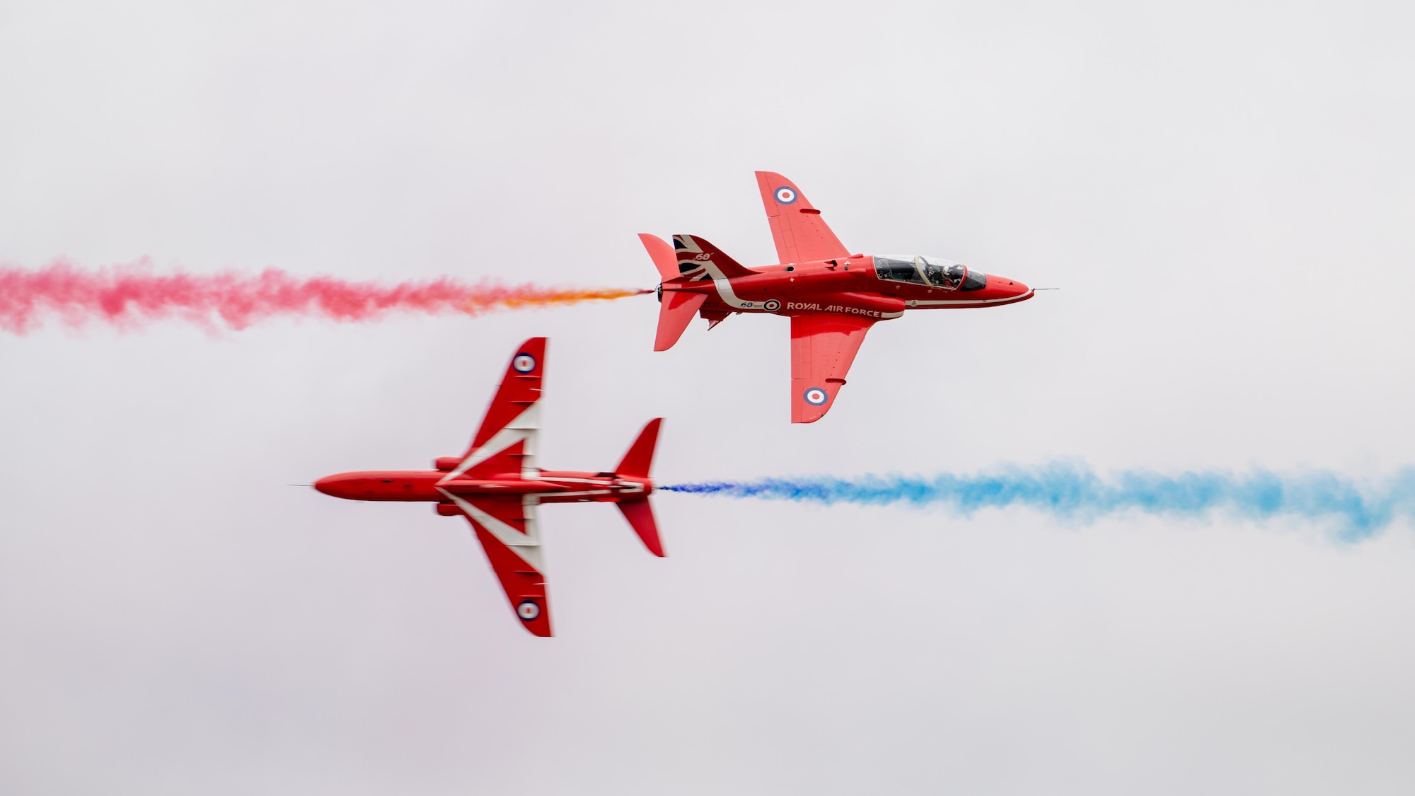 The Royal Air Force Red Arrow aeronautical team conduct an aerial demonstration