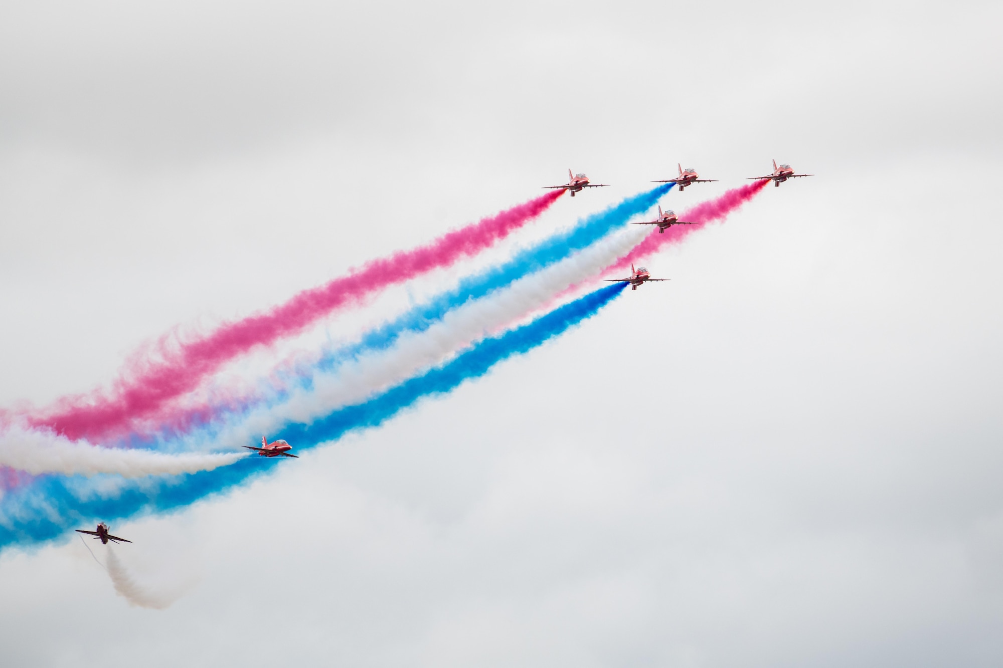 The Royal Air Force Red Arrow aeronautical team conduct an aerial demonstration