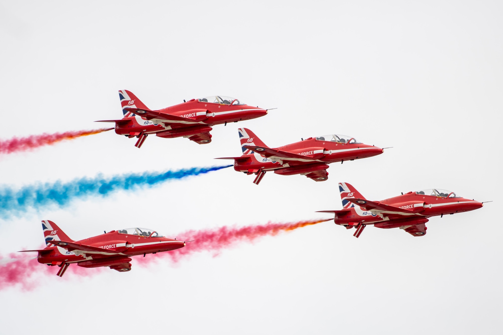The Royal Air Force Red Arrow aeronautical team conduct an aerial demonstration
