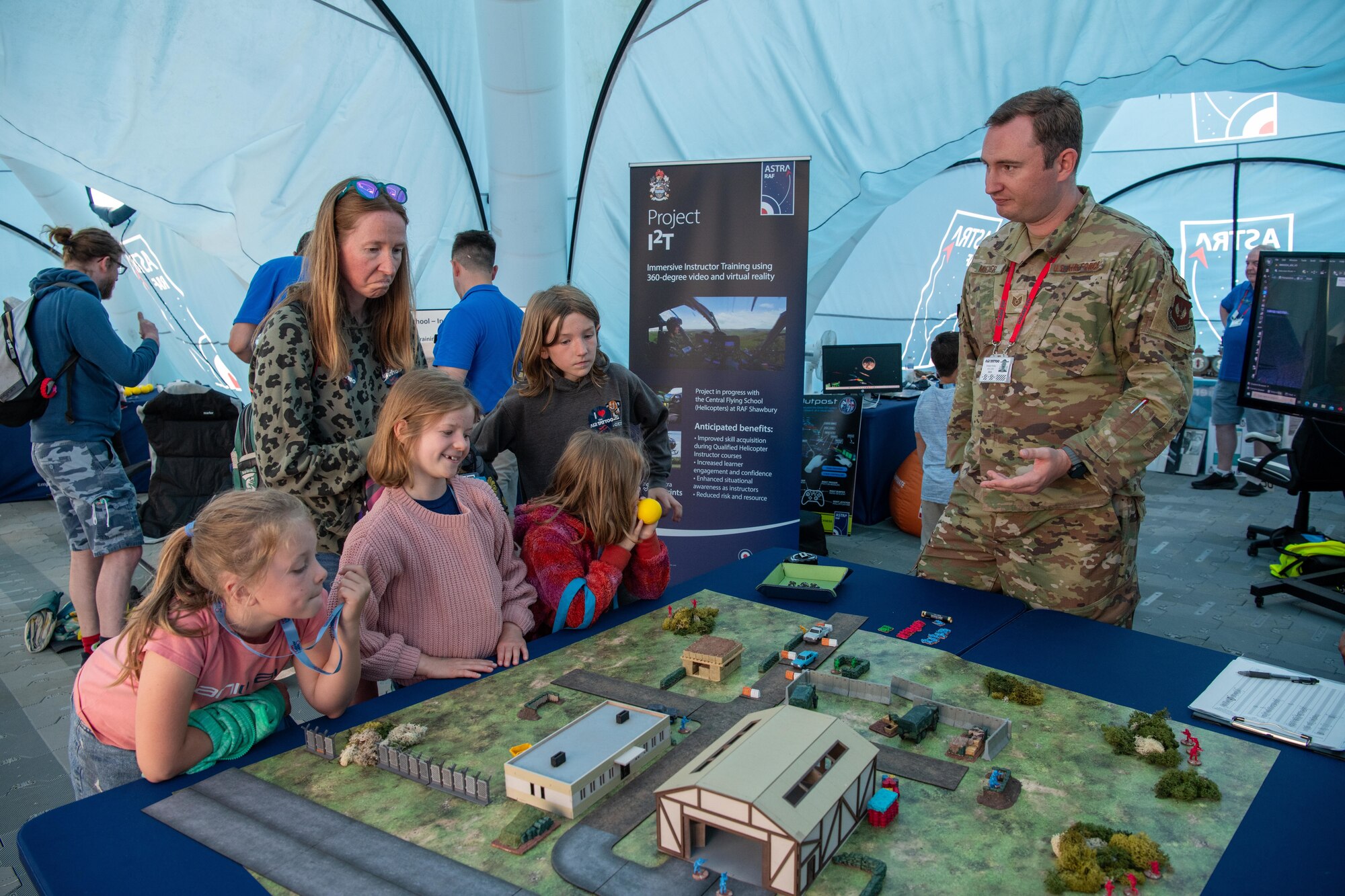 Attendees examine "Integrated Defense Tabletop Training"