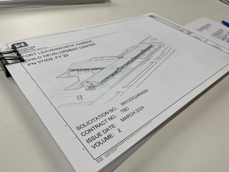 A stack of white papers with black writing on them.