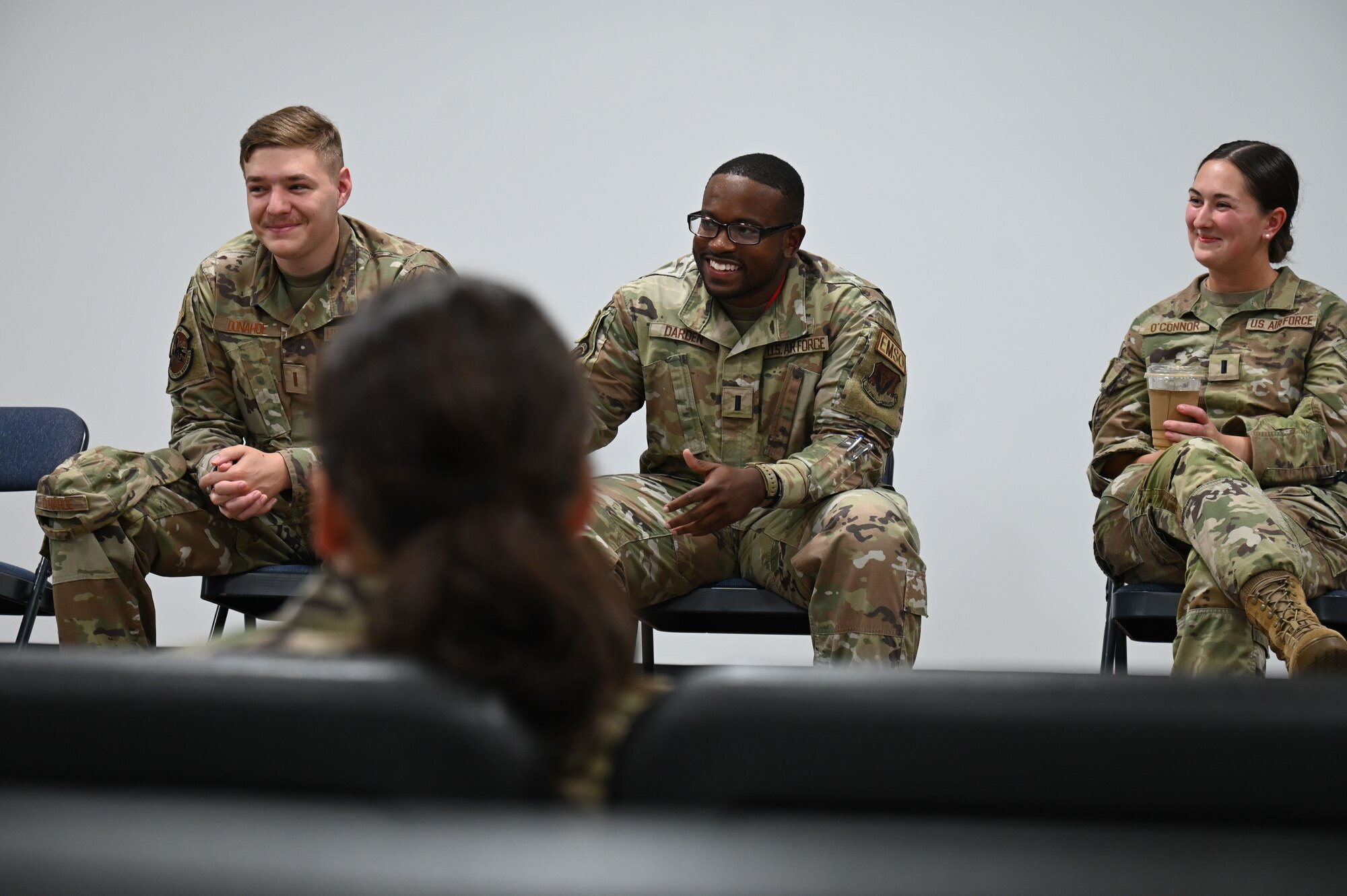 From the left: U.S. Air Force 2nd Lt. Camden Donahoe, 87th Electronic Warfare Squadron; U.S. Air Force 1st Lt. Wylie Darden, 39th Electronic Warfare Squadron; and U.S. Air Force 1st Lt. Mallory O’Connor, 388th Electronic Warfare Squadron, interact with a group of five U.S. Air Force Academy cadets during a company grade officer panel at Eglin Air Force Base, Florida, July 17, 2024. Two of the three lieutenants graduated from USAFA, one from Howard University, all providing valuable insight on what life could be like after graduating and commissioning into the Air Force. (U.S. Air Force photo by Senior Airman Anna Smith)