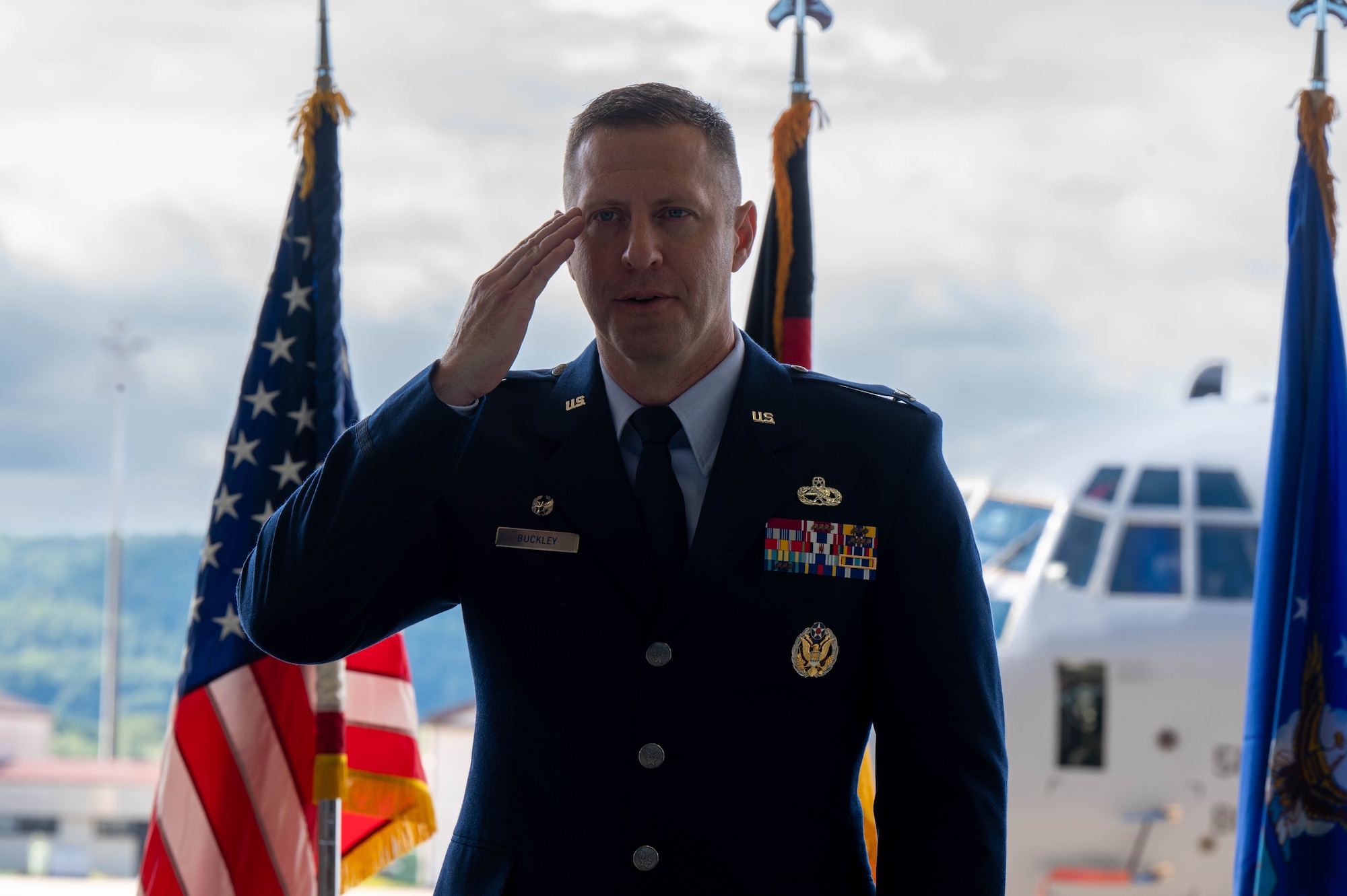 New MXG commander saluting.