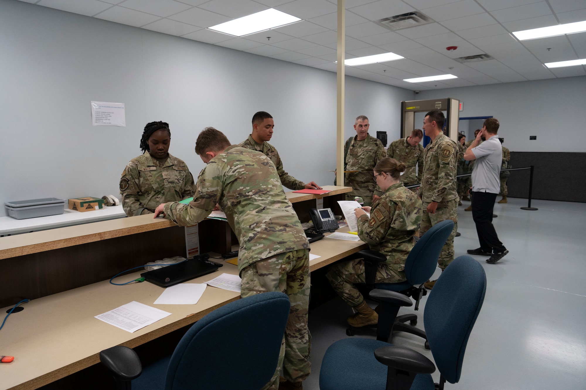 Airmen go through a line