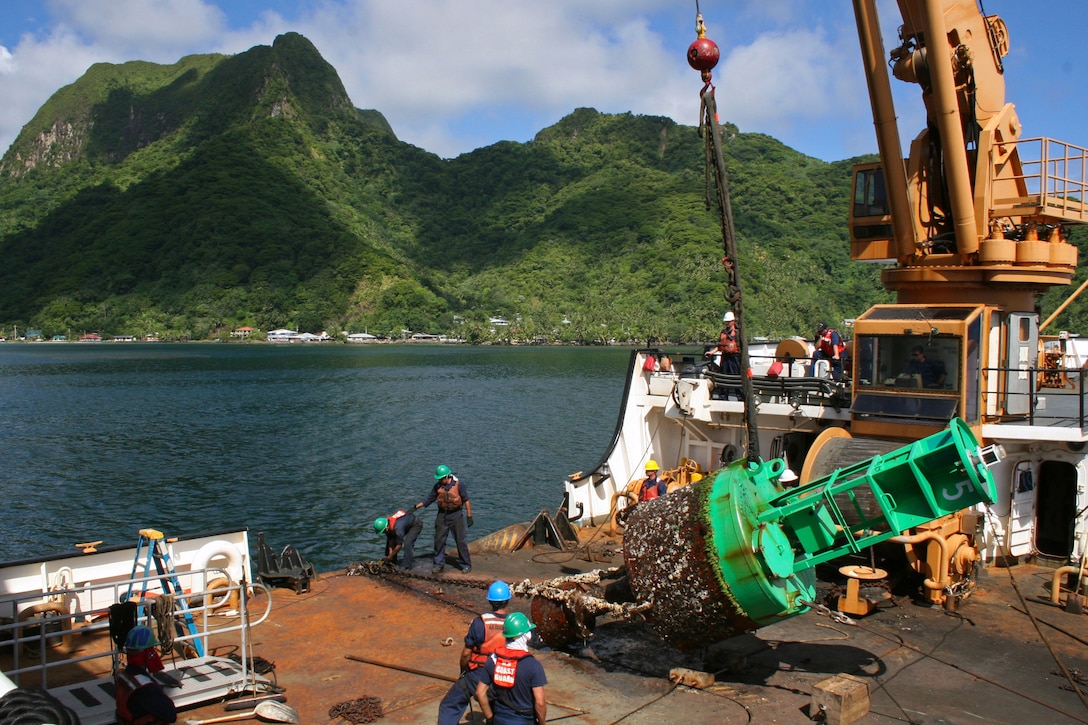 Crewmembers aboard the Coast Guard Cutter Walnut, a 225-foot Seagoing Buoy Tender homeported in Honolulu, work on a navigational buoy near Pago Pago, American Samoa, Wednesday, Nov. 5, 2008.