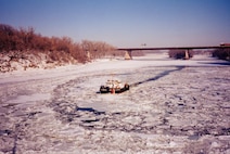 One of the U.S. Coast Guard's small harbor tugs, the CGC Line (WYTL 65611), breaks ice on the Hudson River. USCG photo by PA3 Robert Lanier