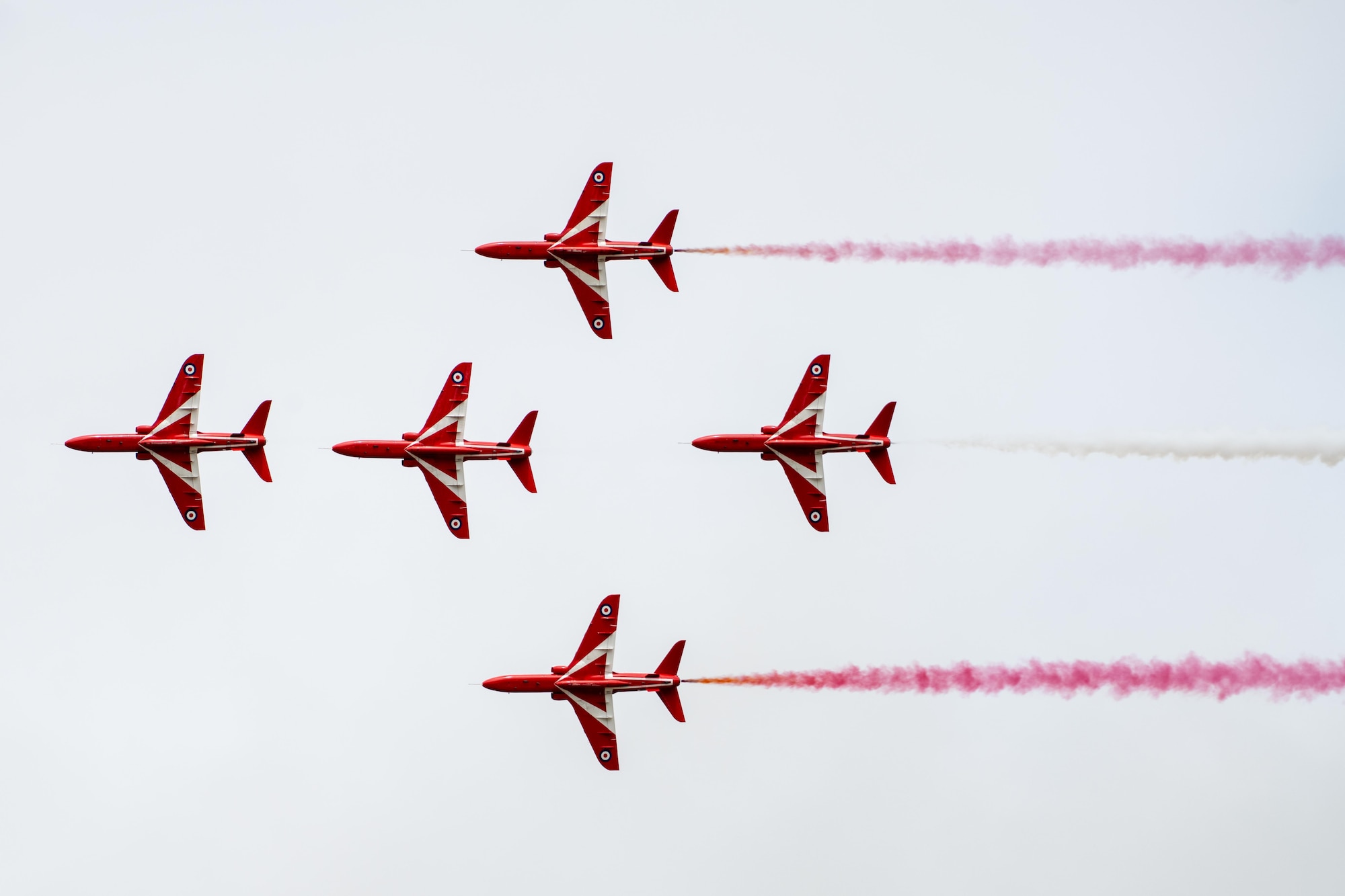 The Royal Air Force Red Arrow aeronautical team conduct an aerial demonstration