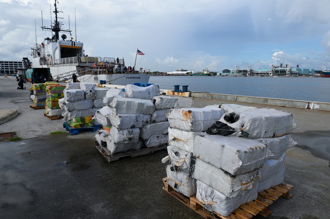 Crew members from Coast Guard Cutter Forward offload more than $96 million in illegal narcotics at Port Everglades, Florida, July 22, 2024. The offload is a result of three suspected drug smuggling interdictions in the international waters of the Caribbean Sea. (U.S. Coast Guard photo by Petty Officer 3rd Class Nicholas Strasburg)