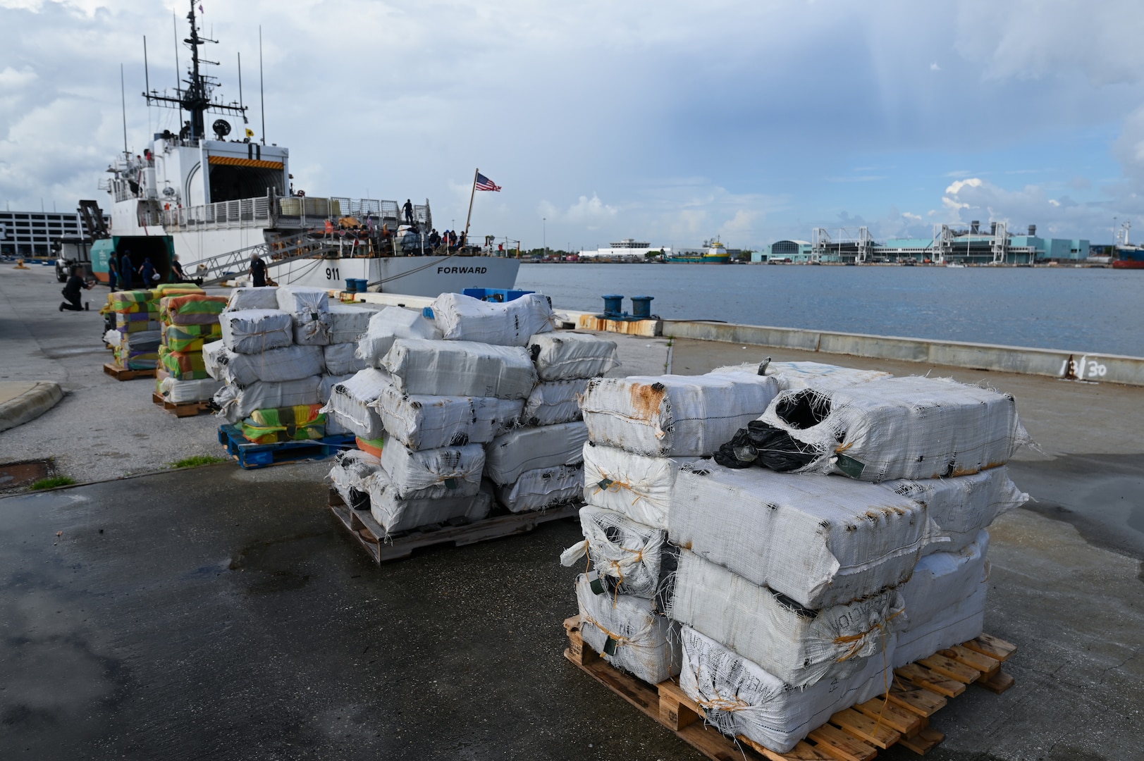 Crew members from Coast Guard Cutter Forward offload more than $96 million in illegal narcotics at Port Everglades, Florida, July 22, 2024. The offload is a result of three suspected drug smuggling interdictions in the international waters of the Caribbean Sea. (U.S. Coast Guard photo by Petty Officer 3rd Class Nicholas Strasburg)