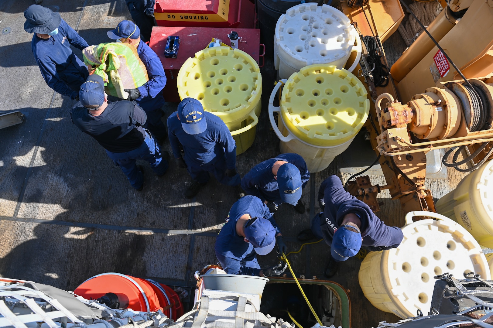 Crew members of the Coast Guard Cutter Forward offloading illicit drugs at Port Everglades, Florida, July 22, 2024. This offload was the result of three separate cases of drug smuggling in the Caribbean Sea. (U.S. Coast Guard photo by Petty Officer 3rd Class Nicholas Strasburg)