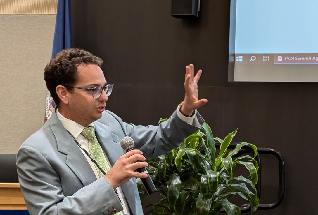 IMAGE: John Romano, head of the Aeronautics, Hypersonic Design & Analysis Branch at Naval Surface Warfare Center Dahlgren Division, reviews the schedule at the Modeling & Simulation (M&S) and Model-Based Systems Engineering (MBSE) Summit July 16 at University of Mary Washington’s Dahlgren Campus. Romano has led the annual summit for six years.