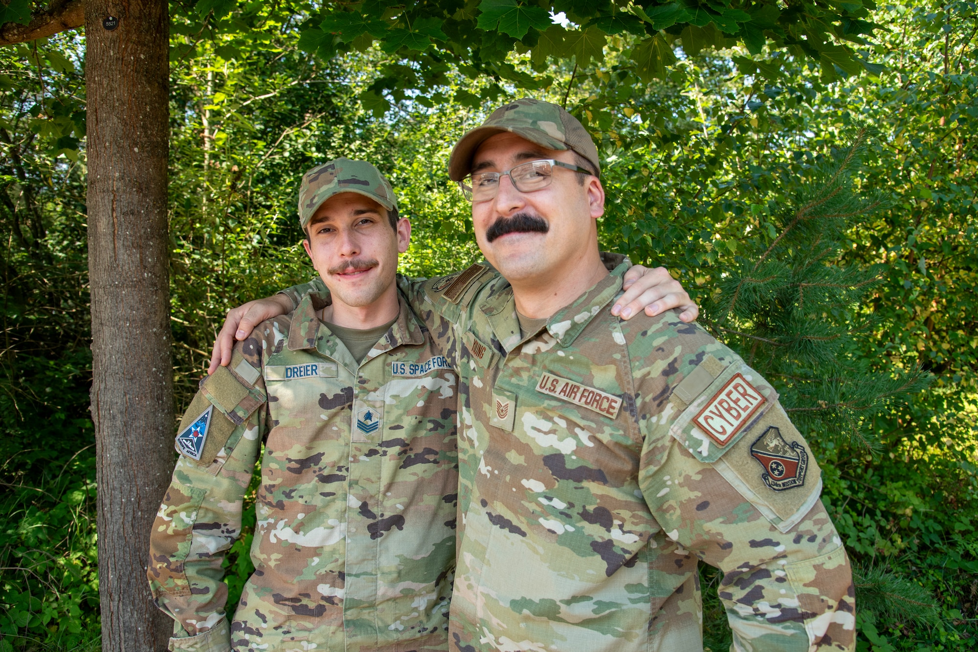 Tennessee Air National Guard member posing for a photo alongside his brother who is serving in the United States Space Force in Germany during annual training.