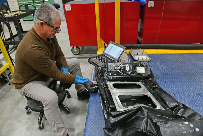 Man working aircraft fuel bladder