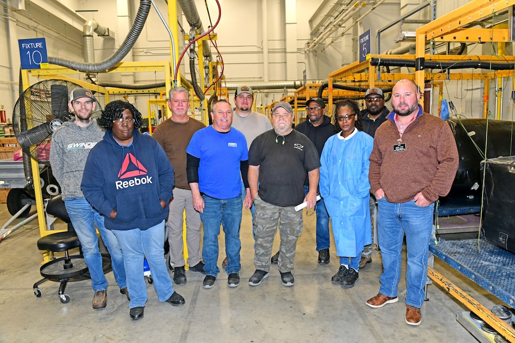 Group photo in maintenance area