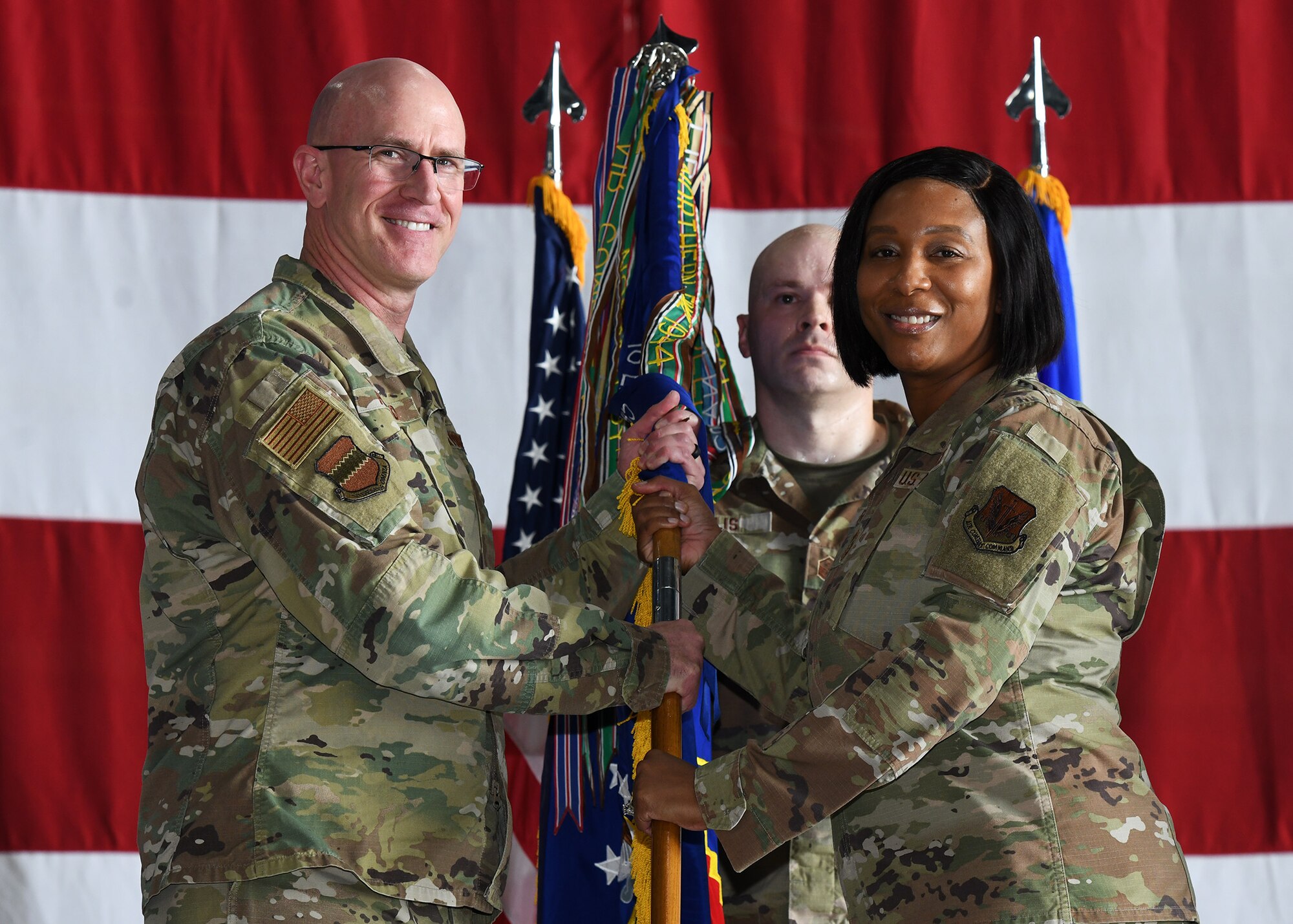 2 people holding flag